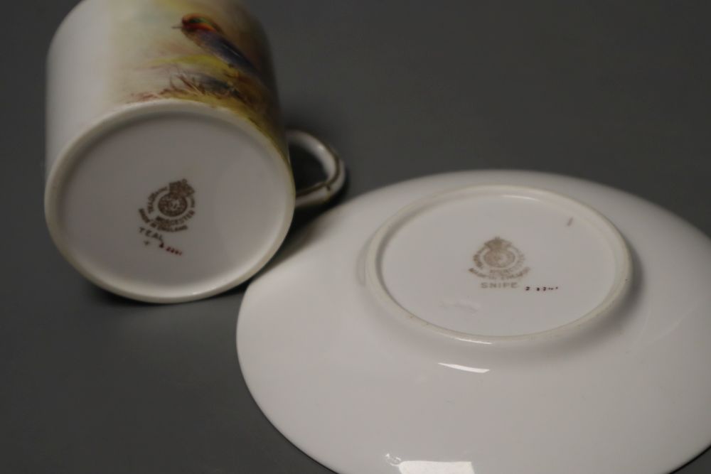 A Royal Worcester coffee can and saucer painted with game birds by P. Platts, signed, date code 1955, 12cm